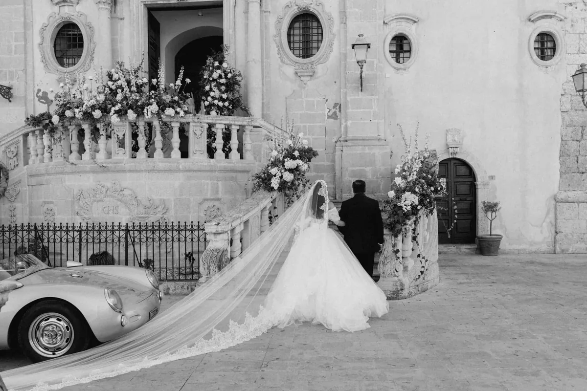 Wedding planner Palermo inspiration with floral doorway and Sicilian historic venue