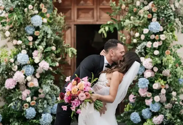 Elegant garden reception in Sicily with blue table linens and floral centrepieces
